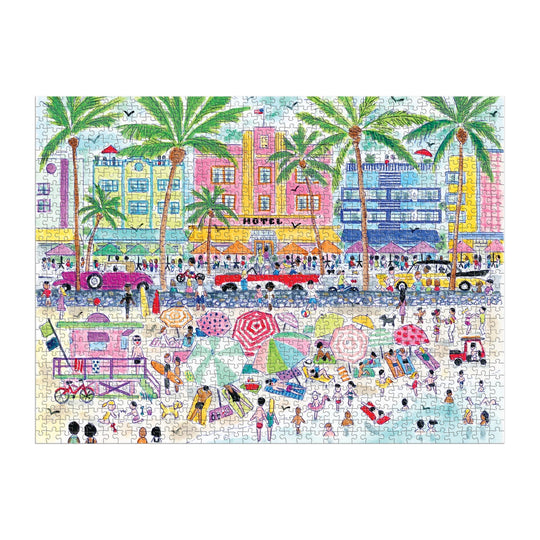 The Michael Storrings South Beach Miami 1000 Piece Puzzle by Michael Storrings features a vibrant beach scene with sunbathers, palm trees, art deco hotels, vintage cars, and lively beachgoers.