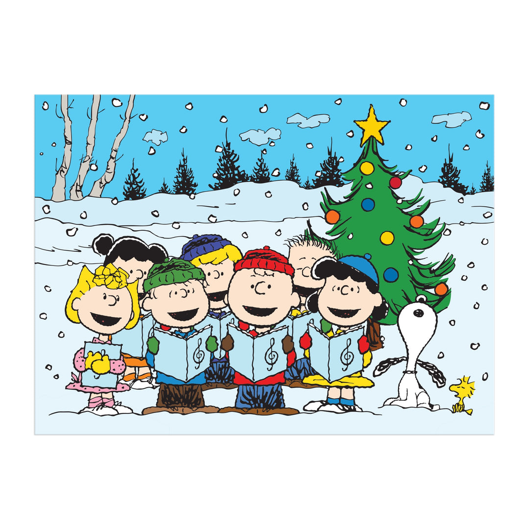The Peanuts Christmas Caroling 1000 Piece Puzzle by Peanuts Worldwide, LLC features Snoopy, Woodstock, and friends singing carols before a decorated tree in the snow—a cheerful Charles Schulz-inspired holiday scene.