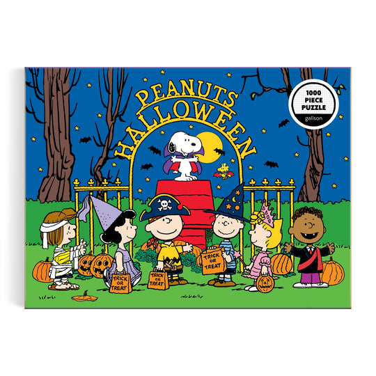 The Peanuts Halloween 1000 Piece Puzzle by Peanuts Worldwide, LLC features Charlie Brown and friends trick-or-treating by a red brick wall at night, with Snoopy as the flying ace atop the wall.