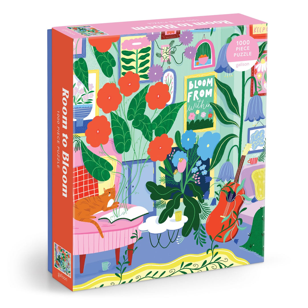 The Room to Bloom 1000 Piece Puzzle by Jessica Smith features a vibrant, cozy room filled with lush plants, a cat on a chair, books, and wall art like the Bloom From Within poster.