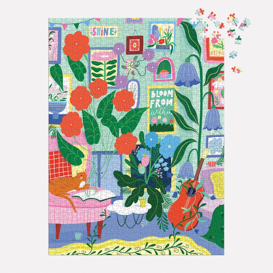 The Room to Bloom 1000 Piece Puzzle by Jessica Smith features a vibrant indoor scene with bold plants, flowers, books, and inspirational posters; some pieces remain unfinished in the top right corner.