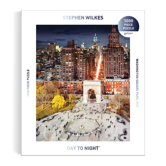 The Stephen Wilkes Day To Night Washington Square Park 1000 Piece Puzzle features an iconic image of the park and arch transitioning from day to night, framed by NYC city buildings. Brand: Stephen Wilkes.