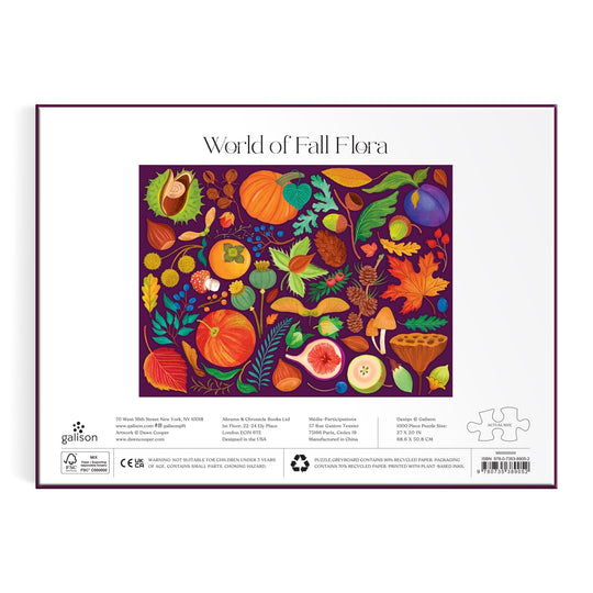 The World of Fall Flora 1000 Piece Puzzle by Dawn Cooper features vibrant autumn plants, fruits, leaves, mushrooms, and acorns on a deep purple background with a white border.