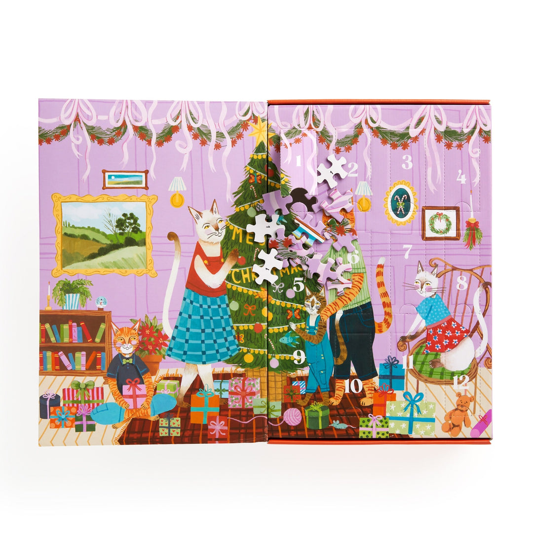 Joanna Letz’s Meowy Christmas 12 Days of Puzzles 500 Piece Countdown features festive cats decorating a tree and exchanging gifts in a cozy room, with numbered doors and puzzle pieces—ideal for cat lovers and advent calendar fun.