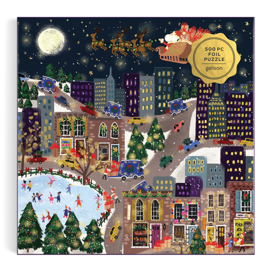 A festive city scene with ice skaters, snowy roads, decorated buildings, and Santas sleigh above the stars. The Joy Laforme Presentville 500 Piece Foil Puzzle is a perfect holiday challenge from Joy Laforme.