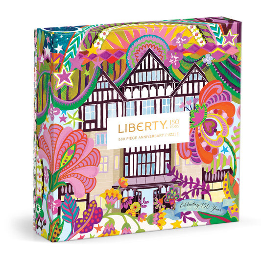 The Liberty 150th Commemorative 500 Piece Double Sided Puzzle by Liberty of London Ltd features vibrant floral and abstract designs, plus a central illustration of the iconic Liberty building.