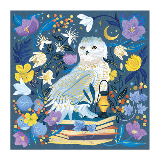 An illustrated white owl sits amid vibrant flowers, books, and a glowing lantern beneath a crescent moon on the Dawn Cooper Celestial Owl 500 Piece Foil Puzzle, featuring whimsical yellows, purples, and blues.