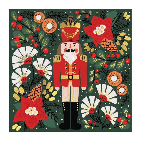 The Merry Nutcracker 500 Piece Foil Puzzle by Sandra Hutter features a nutcracker soldier in a red uniform, surrounded by poinsettias, pinecones, white flowers, and berries on a dark green background for festive holiday magic.