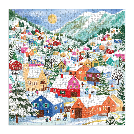 Experience the magic of winter with Joanna Clay's Swiss Alpine Village 500 Piece Foil Puzzle, featuring snow-covered houses, skaters, skiers, evergreen trees, and mountains beneath a bright sun.