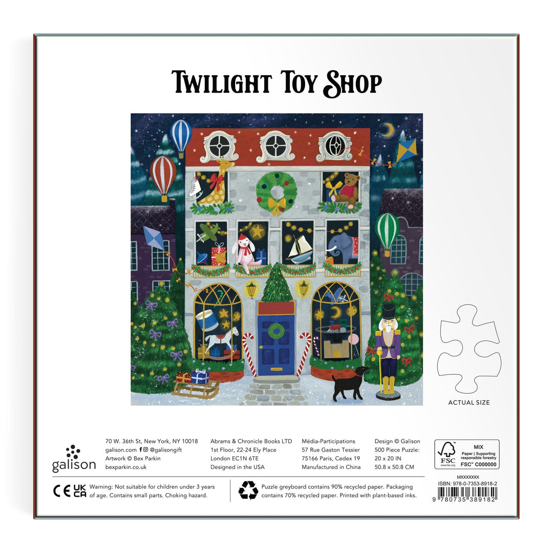 Enjoy the magical "Twilight Toy Shop 500 Piece Foil Puzzle" by Bex Parkin, featuring a festive night scene with animals, toys, wreaths, Christmas lights, floating hot air balloons, and falling snow in vibrant detail.
