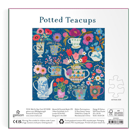 The image shows the back of the Victoria Ball Potted Teacups 500 Piece Foil Puzzle box, featuring colorful teacups with vibrant flowers in a grid on blue. A puzzle piece illustrates the actual piece size. Brand: Victoria Ball.