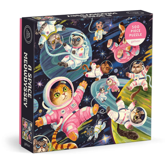 The Lucia Baertl "A Space Meowdyssey 500 Piece Puzzle" features illustrated cats in colorful space suits floating among planets and stars, offering a fun cosmic cat adventure.