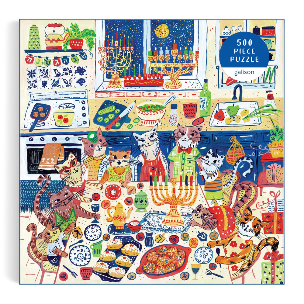 Celebrate Hanukkah with Anna Ivanir’s “Happy Hanukcats” 500 Piece Puzzle: festive cats in aprons gather in a colorful kitchen with menorahs, holiday treats, and decor as snow falls outside.