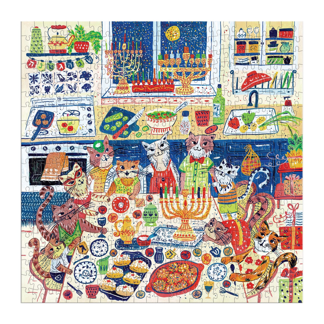 The Happy Hanukcats 500 Piece Puzzle by Anna Ivanir features cats in aprons and hats celebrating Hanukkah in a kitchen with menorahs, candles, latkes, jelly donuts, and dreidels for a festive feline scene.
