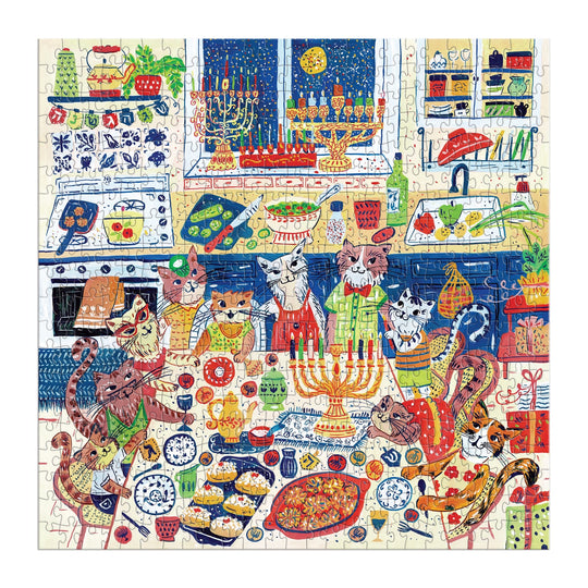 The Happy Hanukcats 500 Piece Puzzle by Anna Ivanir features cats in aprons and hats celebrating Hanukkah in a kitchen with menorahs, candles, latkes, jelly donuts, and dreidels for a festive feline scene.