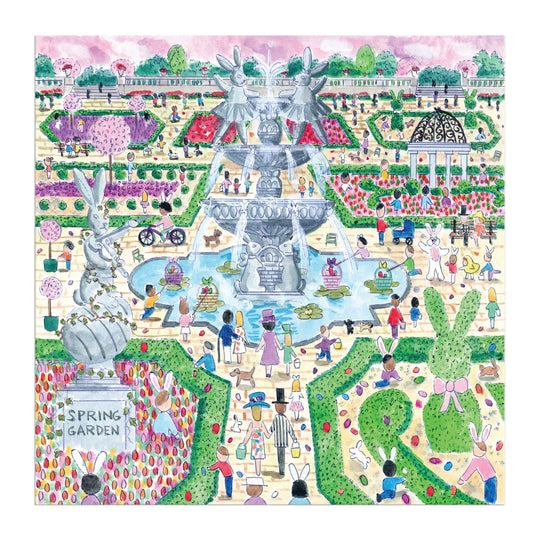 Michael Storrings Spring Egg Hunt 500 Piece Puzzle by Michael Storrings features a lively spring garden with colorful flowers, a grand fountain, rabbit characters, hedges, and people enjoying the “Spring Garden” egg hunt scene.