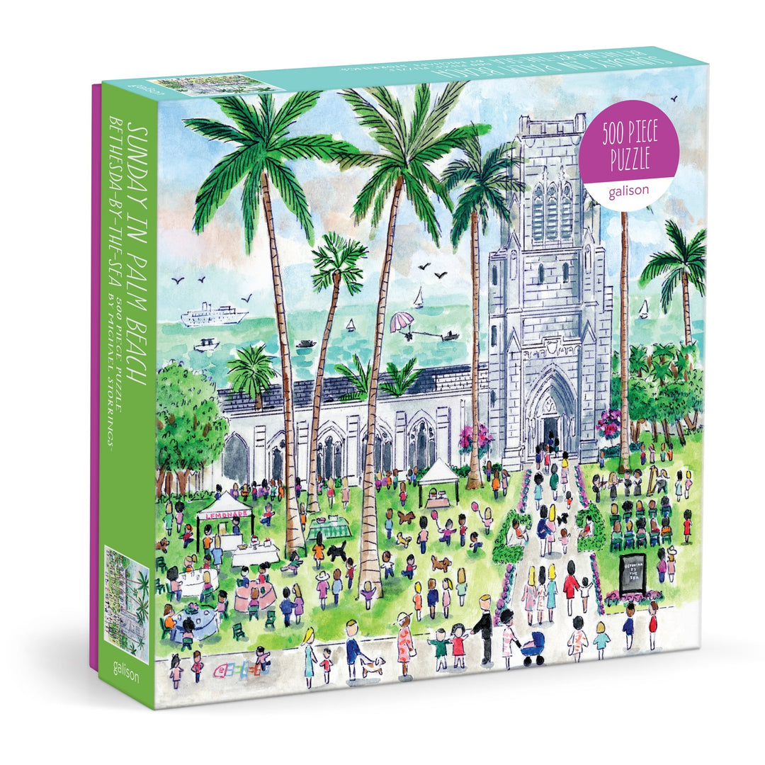 The Michael Storrings Sunday in Palm Beach 500 Piece Puzzle by Michael Storrings features an illustrated park scene with people, palm trees, a cathedral, and tents by the beach under a sunny sky.
