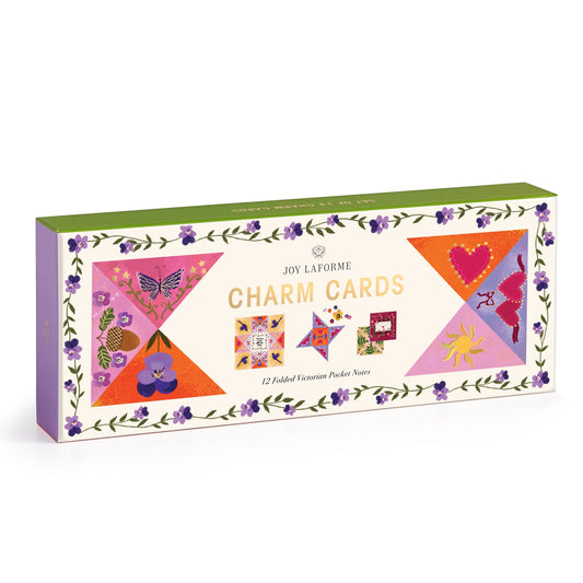 The Joy Laforme Charm Cards by Joy Laforme feature quilt-like patterns and floral borders. This elegant stationery set includes 12 folded notecards adorned with butterflies, hearts, a cat, sun, and flowers for stylish correspondence.