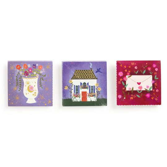 The Joy Laforme Charm Cards set includes three square cards: a vase of flowers on purple, a house with flowers and bird, and refined stationery—a white envelope with red heart on a floral background.