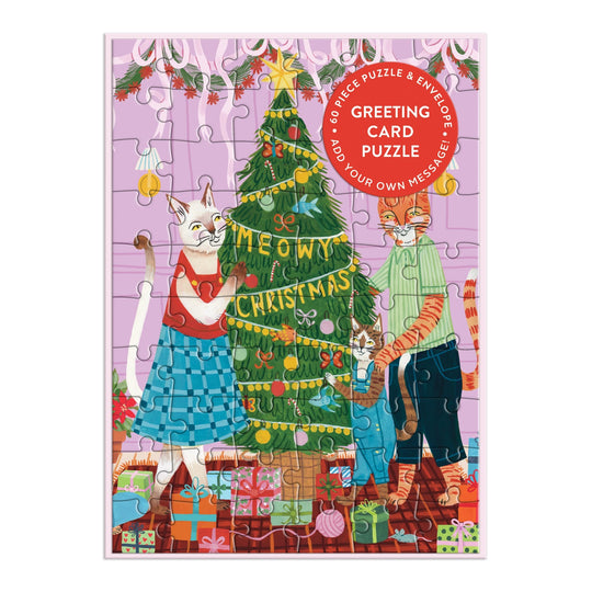 Two cats decorate a festive tree in this cozy, colorful Meowy Christmas Greeting Card Puzzle by Joanna Clay, featuring ornaments, gifts, and holiday decor—perfect for cat lovers this season.
