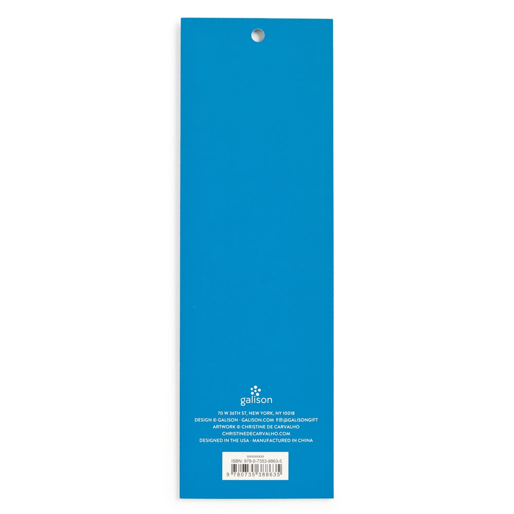 The back cover of a rectangular blue notepad shows the text "Blooming Terrariums Magnetic Bookmarks" by Christine De Carvalho in white at the bottom, a barcode, hanging hole at top, and manufacturing details are also printed in white.