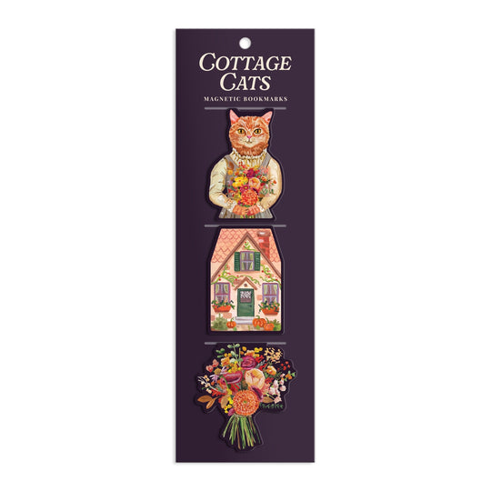 The Cottage Cats Magnetic Bookmarks by Anja Riebensahm features three magnetic bookmarks on a dark backing: a cat with flowers, a cottage house, and a colorful flower bouquet.