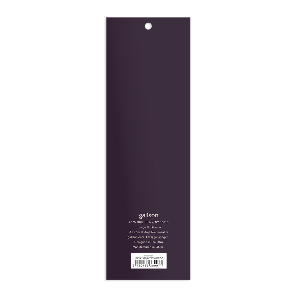 The back cover of a rectangular, vertical Cottage Cats Magnetic Bookmarks by Anja Riebensahm is dark purple with white text detailing the company’s address, design, manufacturing info, and website at the bottom.
