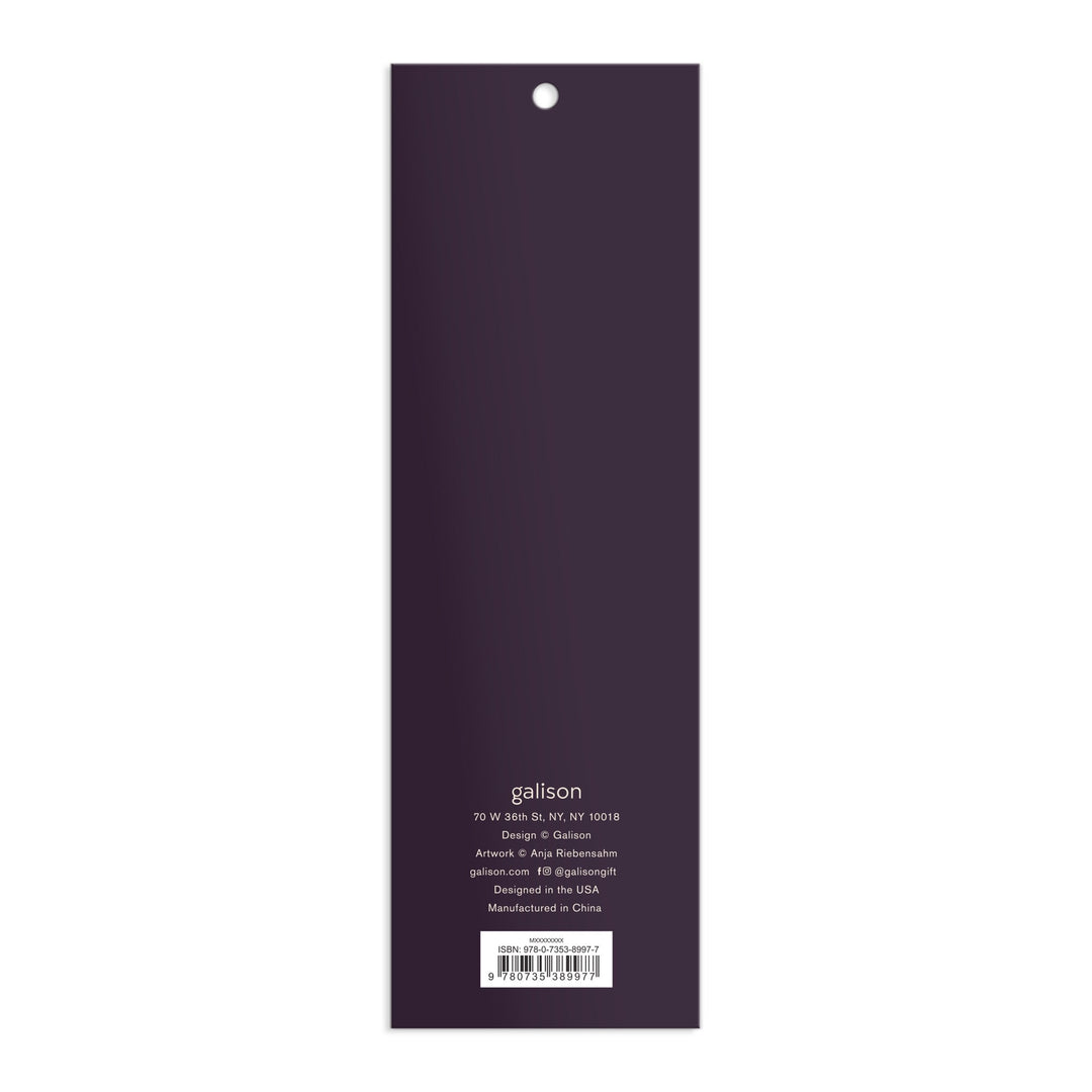 The back cover of a rectangular, vertical Cottage Cats Magnetic Bookmarks by Anja Riebensahm is dark purple with white text detailing the company’s address, design, manufacturing info, and website at the bottom.