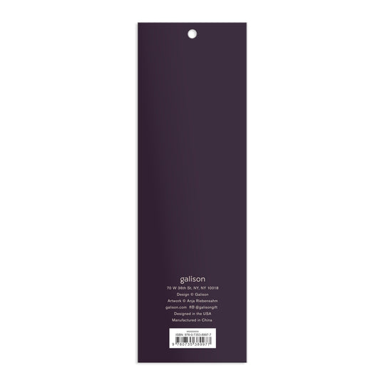 The back cover of a rectangular, vertical Cottage Cats Magnetic Bookmarks by Anja Riebensahm is dark purple with white text detailing the company’s address, design, manufacturing info, and website at the bottom.