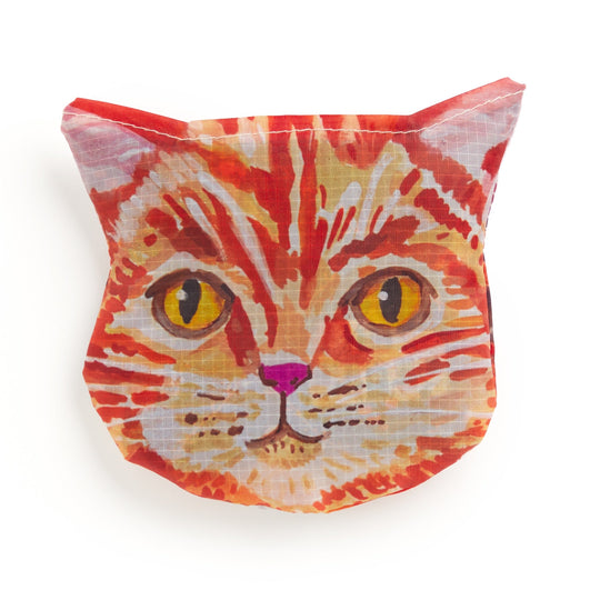The Cottage Cats Packable Nylon Tote by Anja Riebensahm features a cat-face pouch with a colorful, stylized orange tabby cat—vivid yellow eyes, pink nose, and whiskers—on a white background.