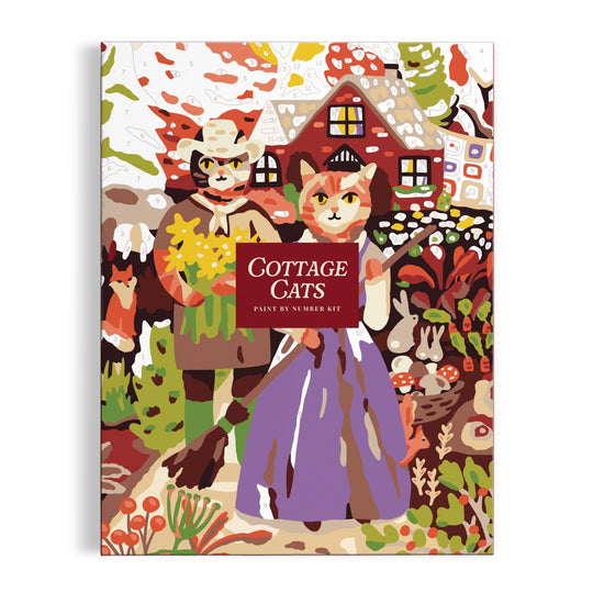 The Cottage Cats 9 x 12 Paint by Number Kit from Anja Riebensahm features two country-dressed cats standing before a cottage, surrounded by flowers and garden plants.