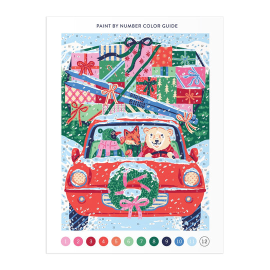 The Christmas Joyride 9 x 12" Paint by Number Kit by Emily Taylor features a red car with a dog and cat inside, adorned with a wreath and piled high with gifts on the snowy roof—a festive scene to paint and enjoy.