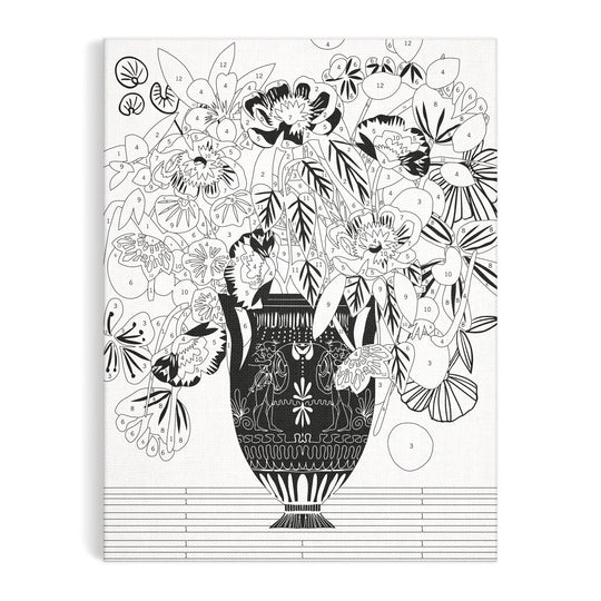 The Kitty McCall Etruscan Vase 9 x 12" Paint by Number Kit features a black and white illustration of a patterned vase filled with flowers and leaves, with numbered sections for easy painting.