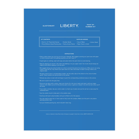A blue instruction sheet for the Liberty London Liberty 9 x 12 Paint by Number Kit Glastonbury features centered white text with step-by-step instructions, kit contents, and needed supplies, including premium acrylic paints.