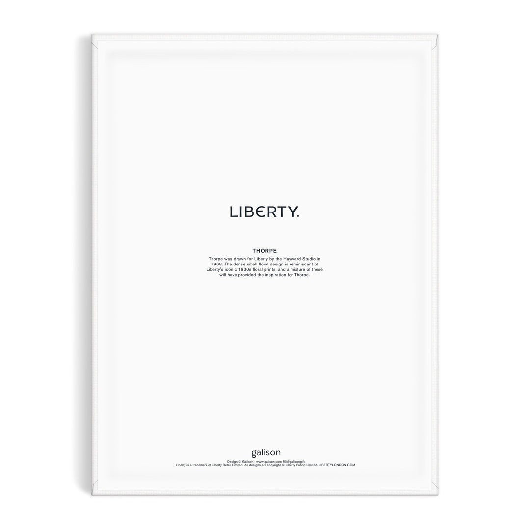 Minimalist art print inspired by the Liberty textile archive, featuring LIBERTY. in bold above a Thoreau quote on white. Framed in white, with Liberty London and “Liberty 9 x 12 Paint by Number Kit Thorpe” noted at the bottom.
