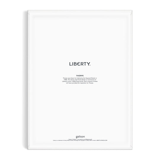 Minimalist art print inspired by the Liberty textile archive, featuring LIBERTY. in bold above a Thoreau quote on white. Framed in white, with Liberty London and “Liberty 9 x 12 Paint by Number Kit Thorpe” noted at the bottom.