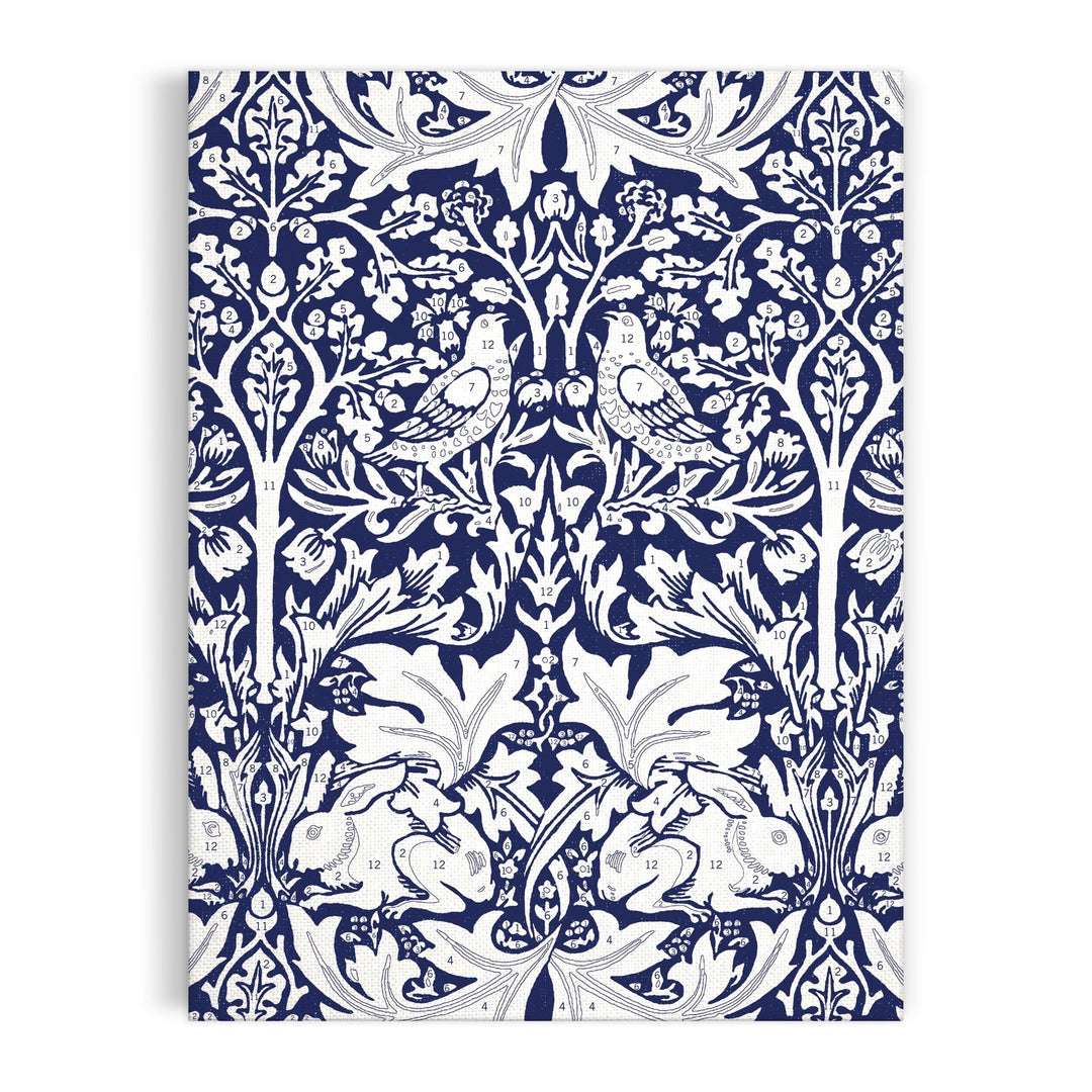 The William Morris Brother Rabbit 9 x 12" Paint by Number Kit features a vintage white-on-blue pattern with two birds on branches and two rabbits among ornate leaves and flowers. Brand: William Morris.