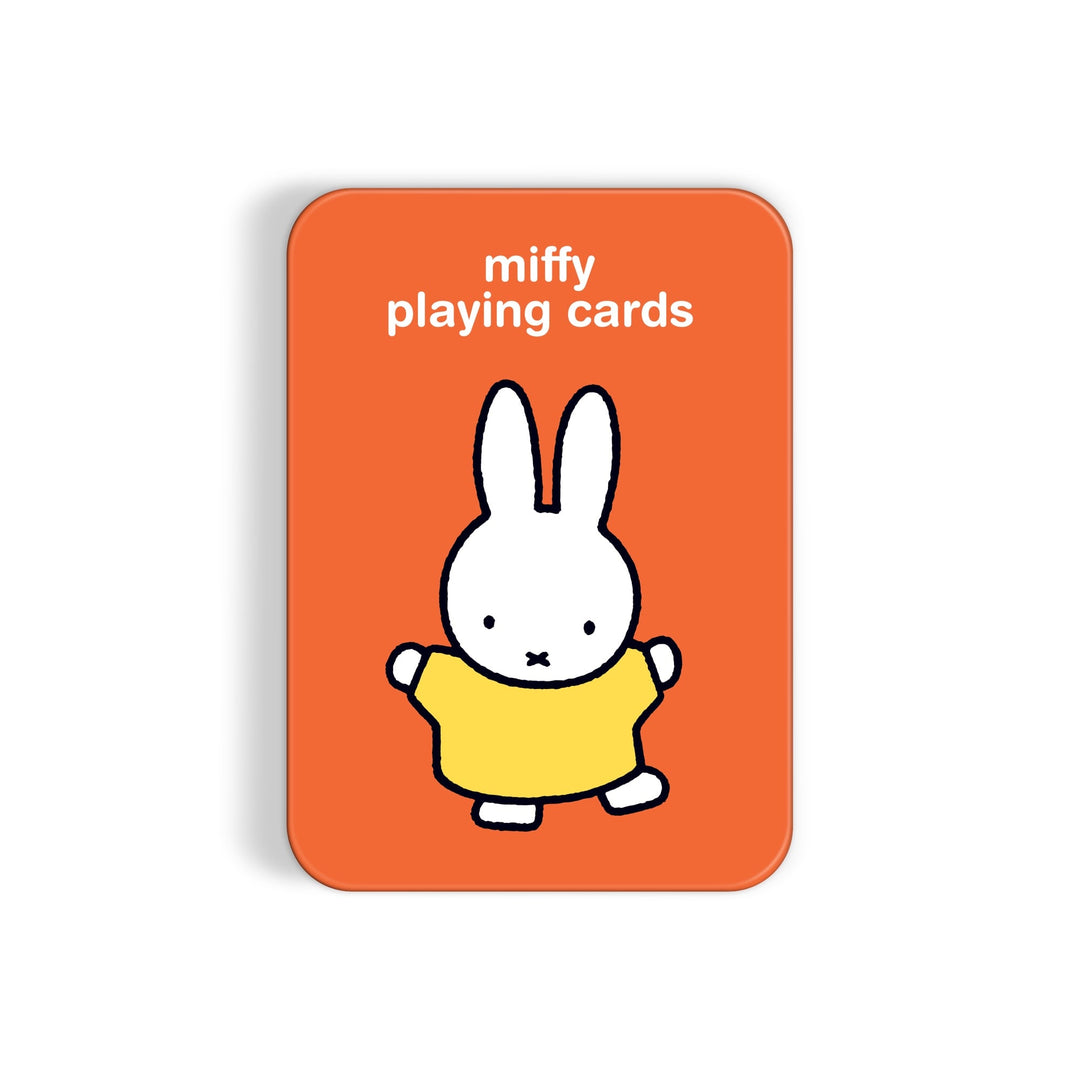 The Miffy Playing Card Deck by Miffy comes in a rectangular orange tin featuring “miffy playing cards” text and an illustration of a white bunny in a yellow dress.