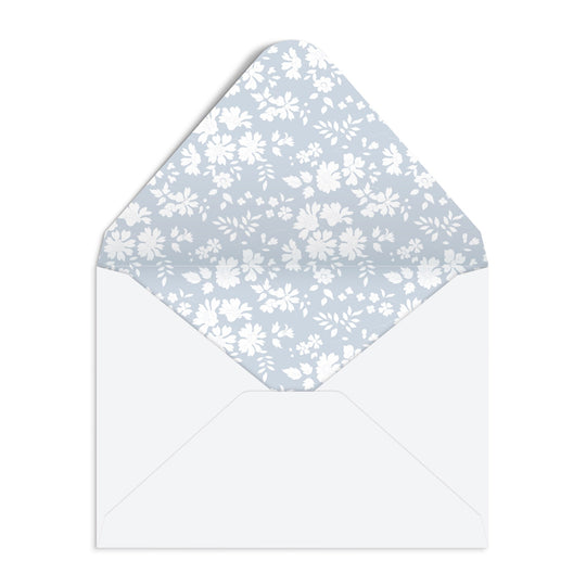 An open white envelope from the Liberty London Liberty Premium Notecard Set features a blue interior with white floral patterns.