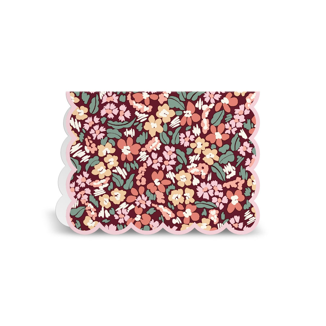The Liberty London Liberty Premium Notecard Set features a rectangular card with scalloped edges and a vibrant floral pattern in pink, yellow, red, and green on a dark background. The design is densely packed with flowers and leaves.