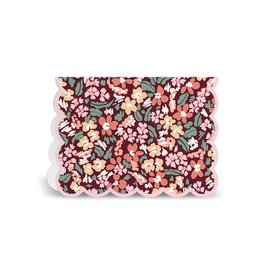 The Liberty London Liberty Premium Notecard Set features a rectangular card with scalloped edges and a vibrant floral pattern in pink, yellow, red, and green on a dark background. The design is densely packed with flowers and leaves.