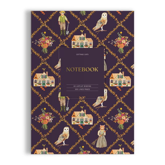 The Anja Riebensahm Cottage Cats A5 Premium Notebook features a dark purple cover with cottages, floral bouquets, owls, and vintage-dressed cats. The center label reads: Cottage Cats NOTEBOOK.
