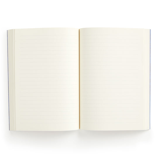 The Liberty Glastonbury Premium A5 Notebook by Liberty London is shown open from above, displaying both blank, lined pages with premium white or light cream paper thats ready for writing.