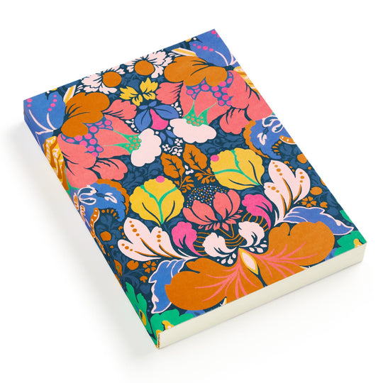 The Liberty Glastonbury Premium A5 Notebook by Liberty London features a vibrant floral cover in orange, pink, yellow, green, and blue hues and is displayed on a white background.