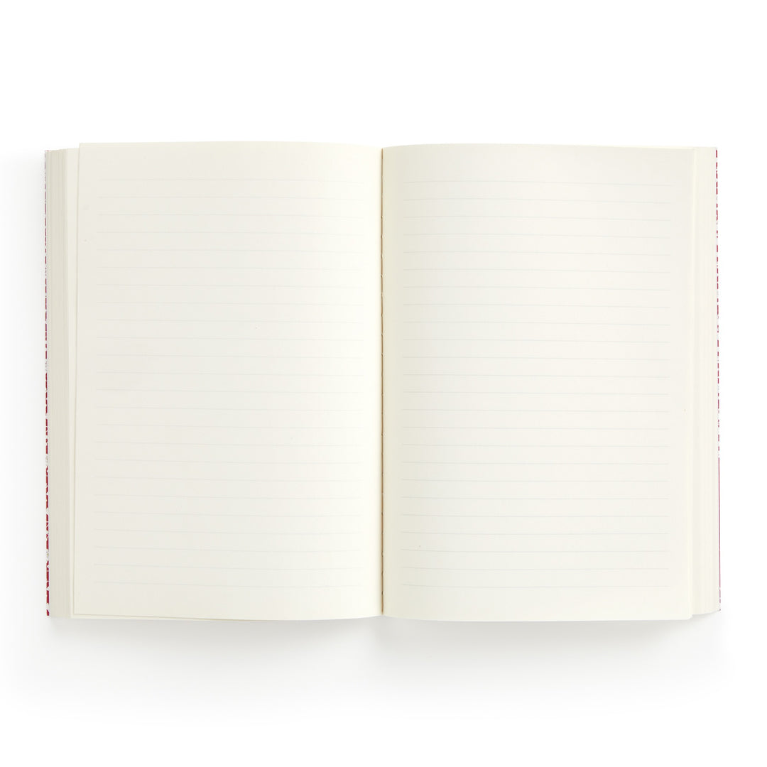 The Liberty London Liberty Nell, Annie and May Premium A5 Notebook is shown open from above, with cream-colored lined and blank pages against a white background.