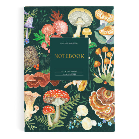 The Olga Akbarova World of Mushrooms Premium A5 Notebook has a dark green cover with vibrant botanical mushroom illustrations and a central label, plus 256 lined pages and layflat binding.