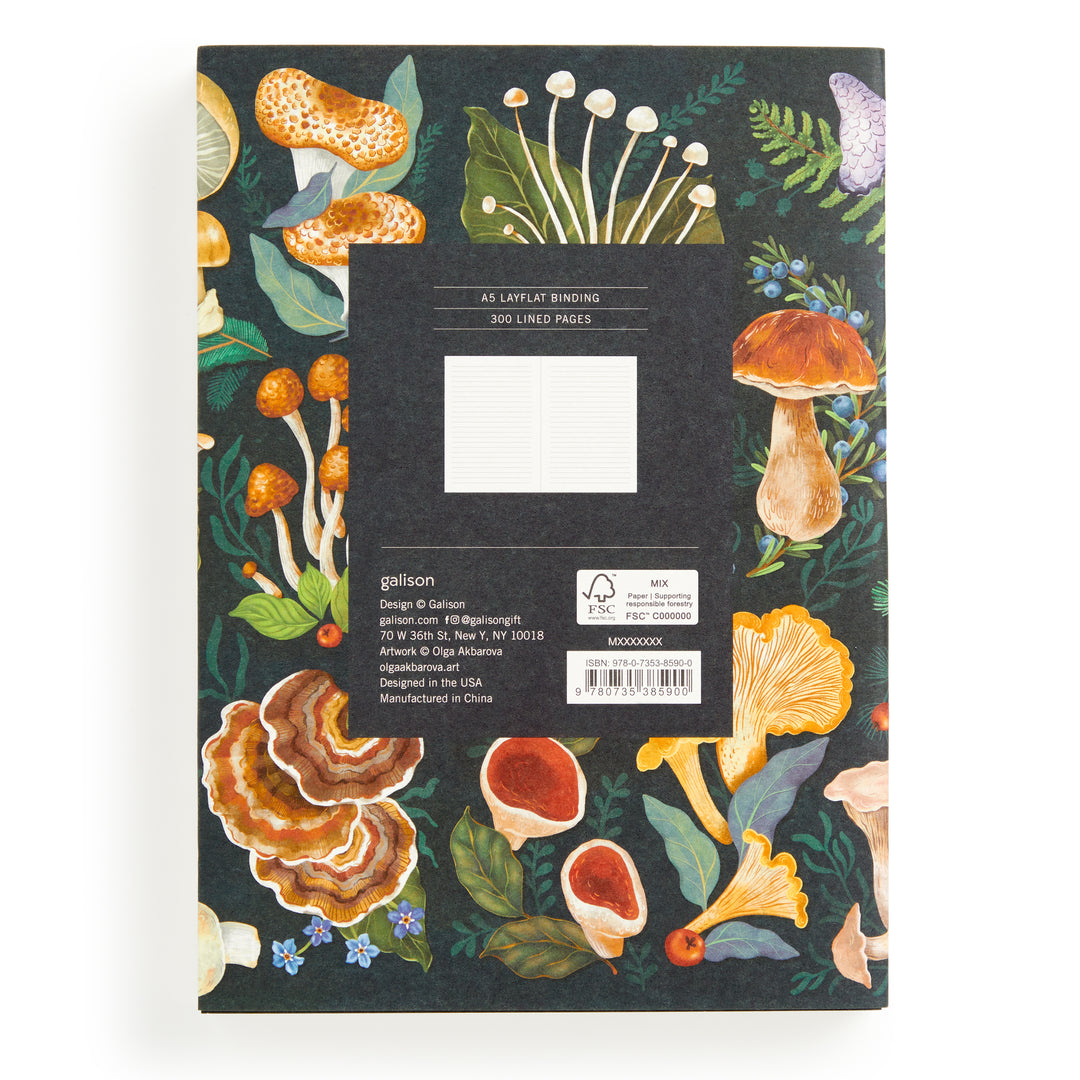 The World of Mushrooms Premium A5 Notebook by Olga Akbarova features a black cover with vibrant mushroom and leaf illustrations, 300 lined pages, and labeled product details—ideal as a botanical journal or mushroom notebook.