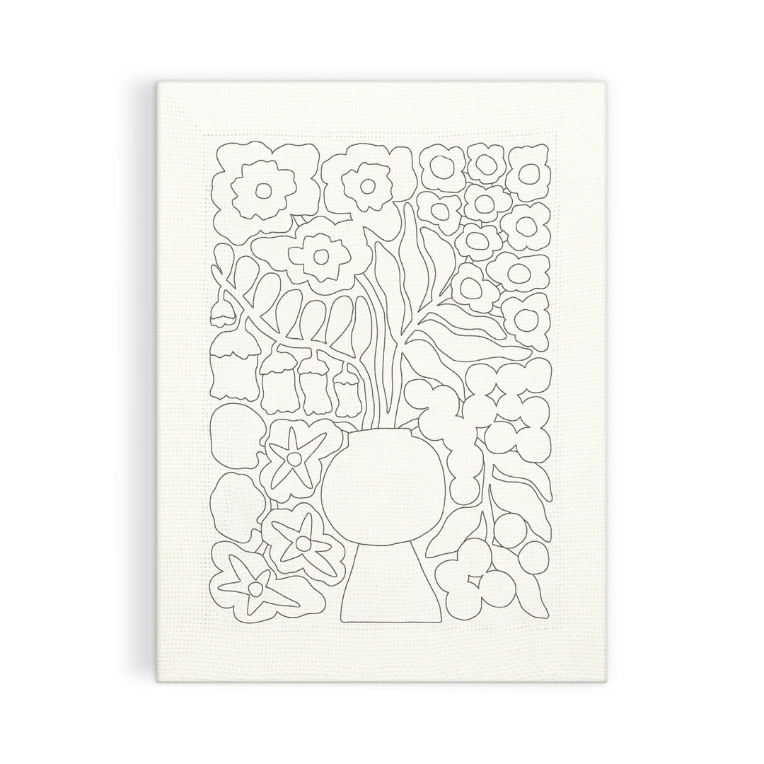 The Blooming Wildflowers Punch Needle Kit by Liv Lee features a line drawing of flowers and leaves in a vase, centered on a white textured background. Simple outlined floral shapes fill the rectangular canvas.