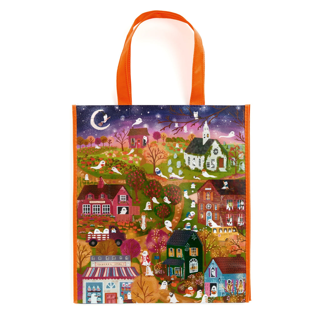 The Joy Laforme Spooky Village Reusable Shopping Bag by Joy Laforme showcases a vibrant nighttime Halloween scene with ghosts, houses, and trees—an eco-friendly tote with orange handles for spirited shoppers.