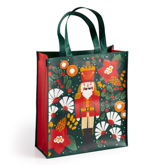 The Sandra Hutter Merry Nutcracker Reusable Shopping Bag features festive holiday artwork with red and white flowers and green foliage on a dark background, dark green handles, red sides—perfect for gifting or puzzle fans.